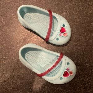 Turquoise and pink charm crocs